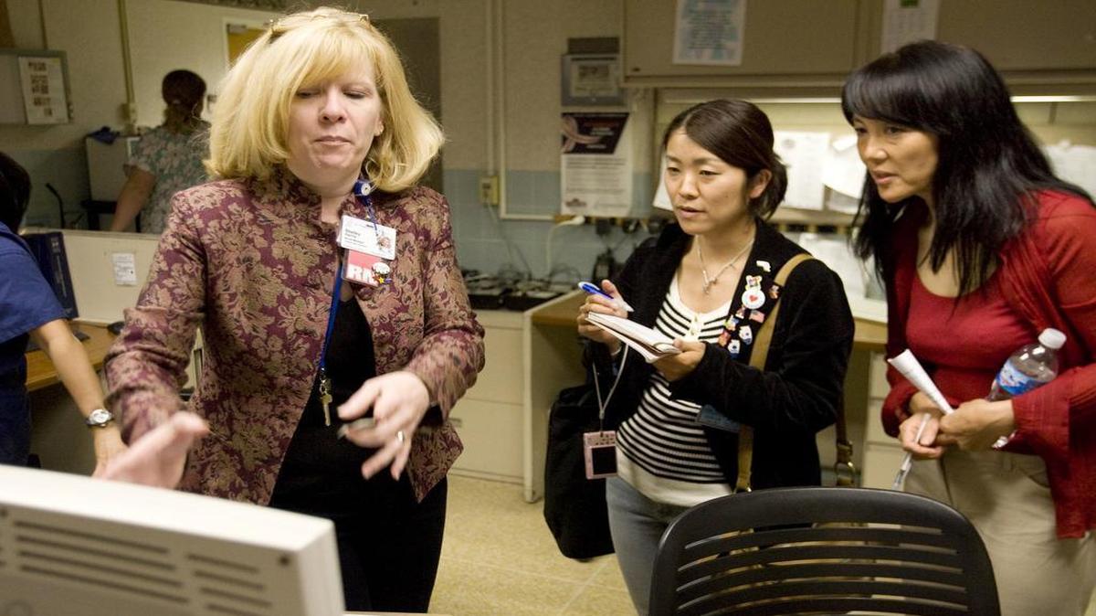 
Shelley Harris, chief nursing officer at St. Elizabeth’s Hospital in Belleville, speaks with Sachiko Kotani and her interpreter Hideyo Mills as they tour the Intensive Care Unit in May 2009. Harris has been appointed as the interim CEO of the hospital effective Friday.
