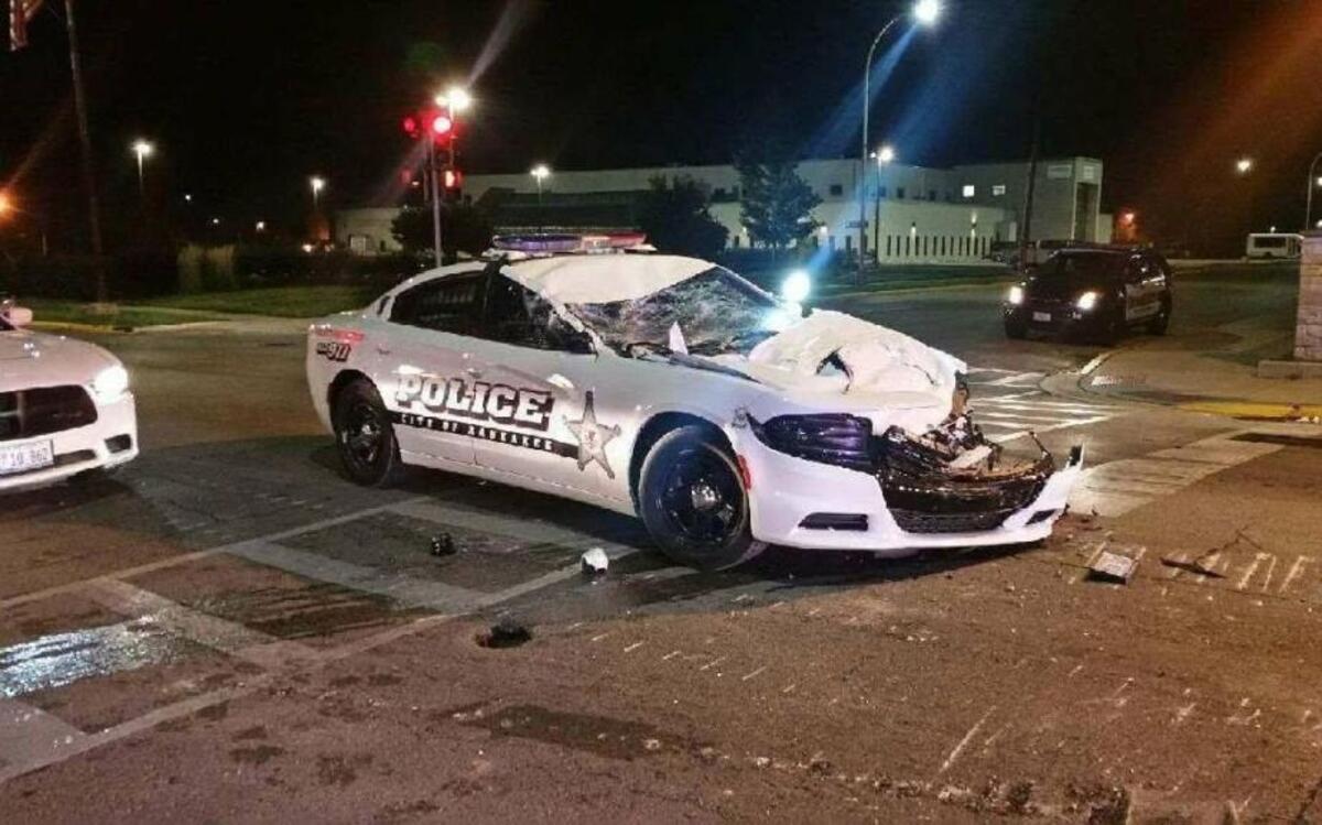 A bulldozer backed into a squad car in Kankakee, Ill., early Thursday morning, crushing the front of it.