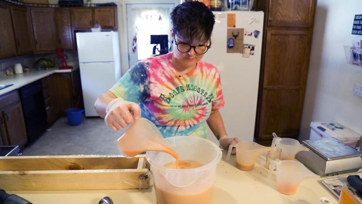 Soaps McGotes owner Monica Moore, of Mascoutah, mixes up a loaf of soap in her kitchen. Though Moore has been making soaps for a while, Soaps McGotes didn’t actually become a business until about 2014. When Moore first started selling her soaps, she made enough money to travel to be with her husband for their anniversary in South Korea, where her husband was stationed at the time.