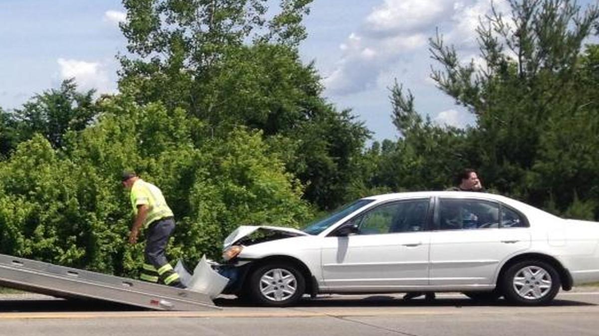 Clete’s NAPA Auto Center two service prepares to haul away a vehicle in a three-car crash that occurred late Memorial Day morning.