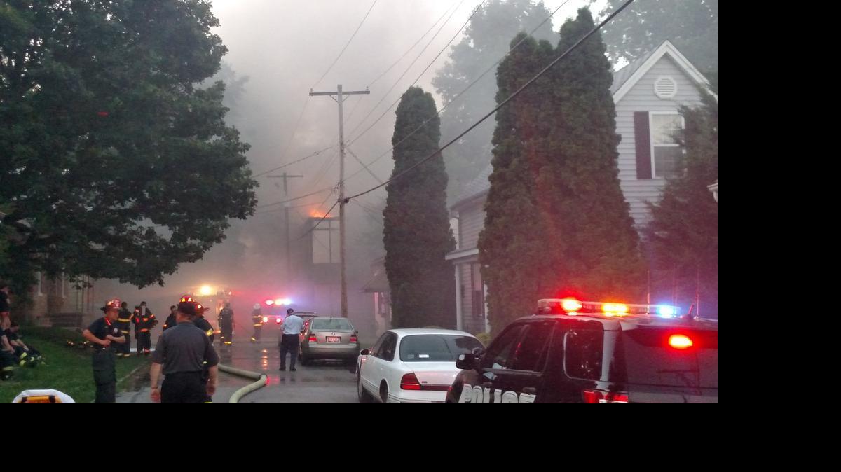
Despite the thick smoke, flames are visible from the top of a building in the 200 block of North Eighth Street in Belleville Tuesday evening.
