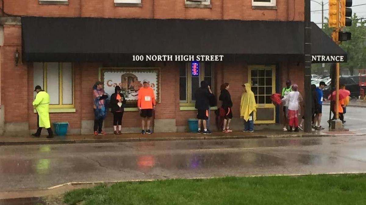 A few runners gathered Saturday morning for the Law Day Run in downtown Belleville, but it was cancelled due to weather.