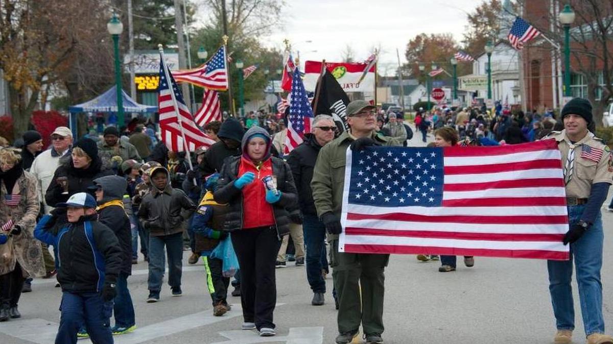 Marchers in an O’Fallon Veterans Day parade last year.