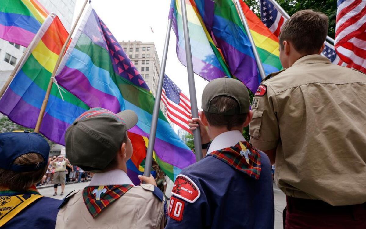 
In this file photo, Cub Scouts and Boy Scouts prepare to lead marchers while waving rainbow-colored flags at the 41st annual Pride Parade in Seattle, two days after the U.S. Supreme Court legalized gay marriage nationwide.
