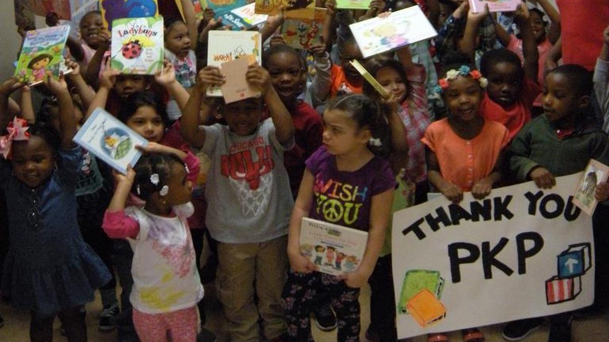 
Children at the SIUE Head Start Center in East St. Louis celebrate receiving nearly 3,000 books collected for them by SIUE students.
