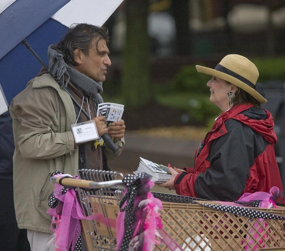 This 2011 file photo shows Patty Gregory talking to Israeli artist Yoram Gal at Art on the Square. She served as the show’s executive director for 20 years before being elected Belleville mayor in 2021.