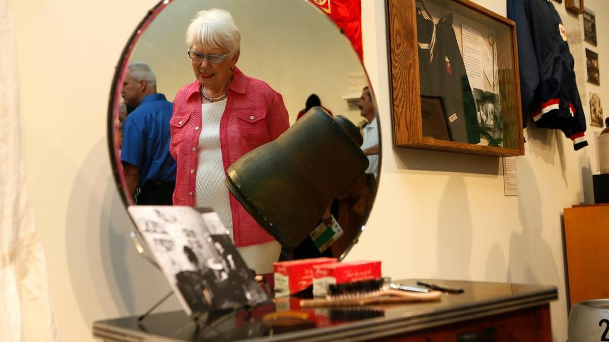 
Bonnie Keel, of Belleville, is reflected in the mirror of a vintage vanity table from a Belleville beauty salon at the “Belleville Bicentennial 200” exhibit that was at the Schmidt Art Center in 2014.
