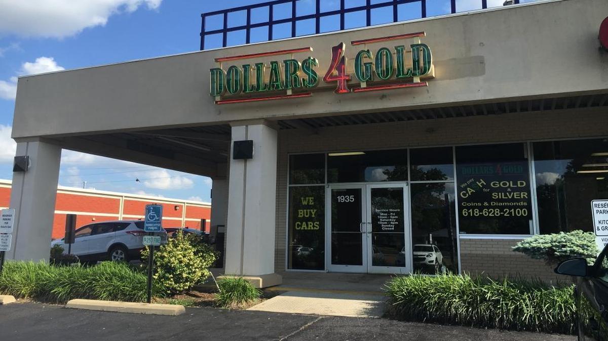 One suspect was caught and one was on the loose Tuesday following a robbery at the Dollars 4 Gold store in O’Fallon