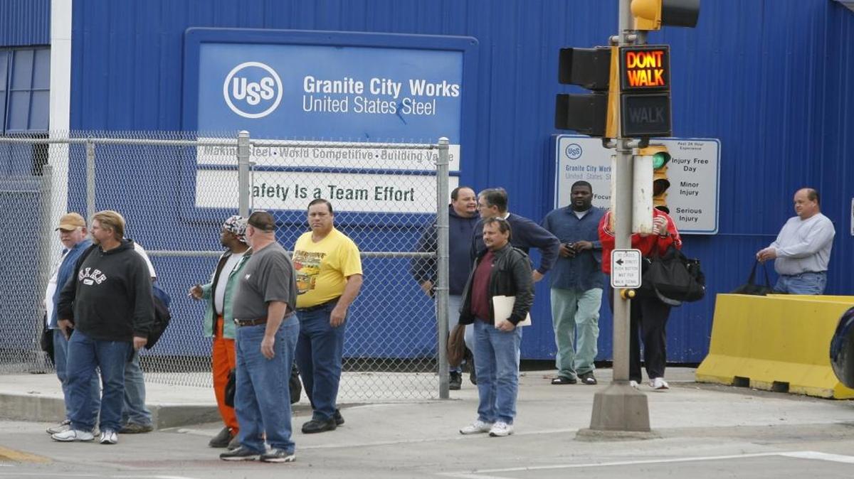 Workers exit Granite City Works plant after a shift change. The company plans to temporarily idle the plant, beginning Sunday.