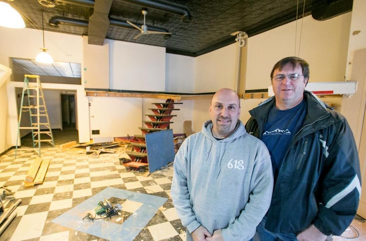 Scott Schmelzel and Mike Thouvenot are inside the future Crafty Sugar Co. at 104 E. Main St. in Belleville. They plan to open their candy, ice cream and craft soda shop in late March or early April.