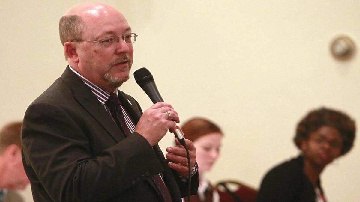 Darrell Coons, executive director of Belleville Main Street, speaks during a Greater Belleville Chamber of Commerce event last year. He plans to retire in June.