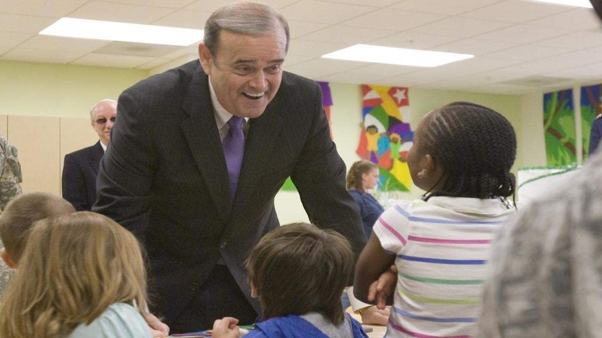 Former Rep. Jerry Costello, D-Ill., visited a child care center at Scott Air Force Base in May 2010. Since leaving Congress three years ago, Costello has made three times as much as his old salary as a lobbyist for companies, unions and trade groups.