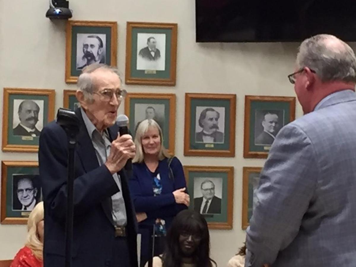 Charlie Woodford, left, received a proclamation from Belleville Mayor Mark Eckert Monday night during the City Council meeting. Woodford, who was elected the first president of the Belleville East Lancer Booster Club in 1973, has attended Belleville East football games for over 50 years and only missed three games.
