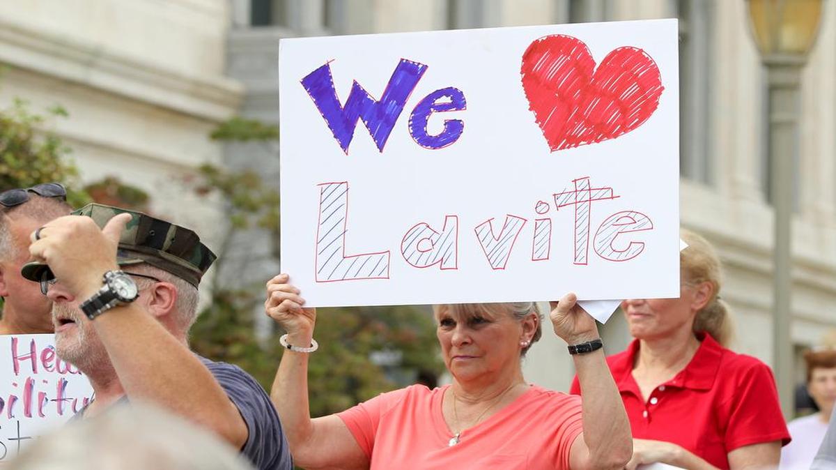 Sandra Doerr, the mother of Bradley Lavite, holds a sign supporting her son. A crowd of military veterans and supporters gathered at the Madison County Courthouse on Friday. The group wants county officials to allow veterans advocate Bradley Lavite back on county property. See a gallery of photographs and a video at bnd.com.
