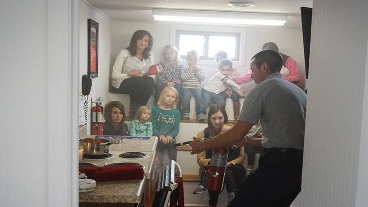 
Highland-Pierron Fire Department Capt. Todd Zobrist gives a presentation, which included demonstrations on kitchen hazards, inside the department’s new fire safety demonstration trailer. 
