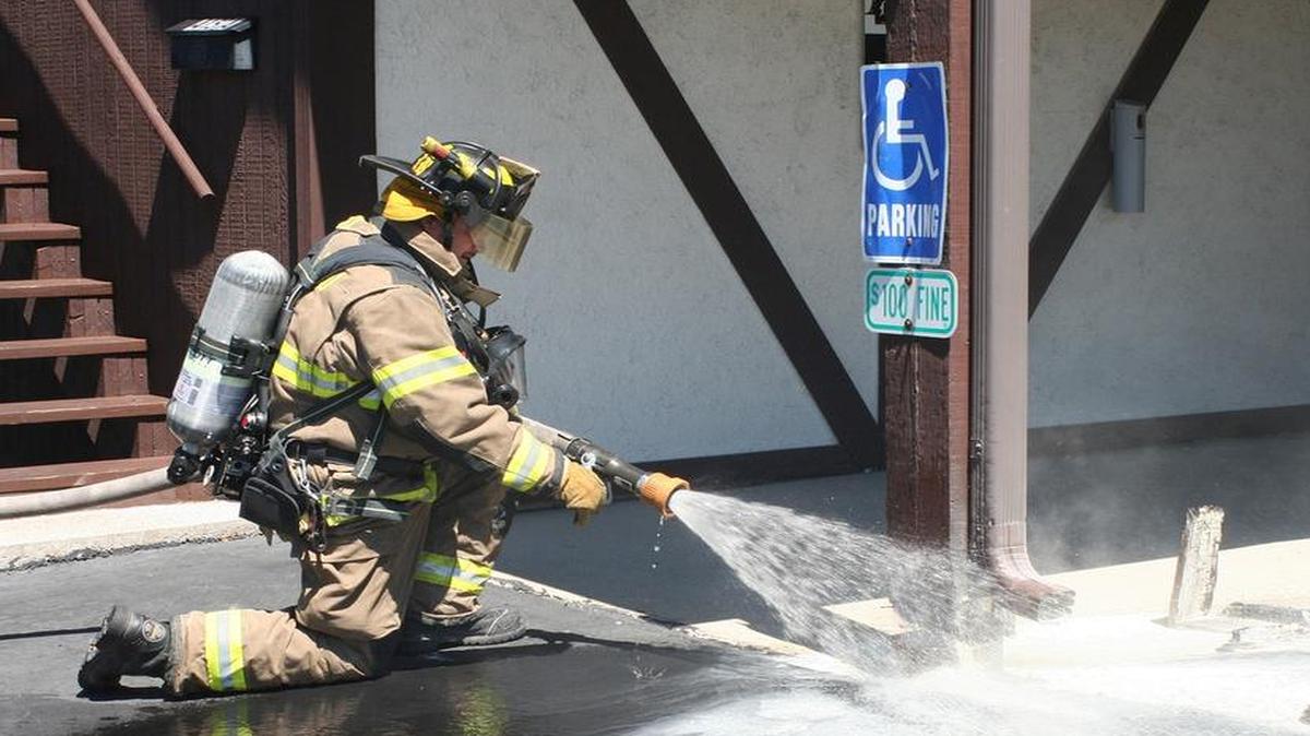 
Highland firefighter Ty Barr extinguishes a fire that started at the base of an exterior post at Michael’s Restaurant in Highland on Monday.

