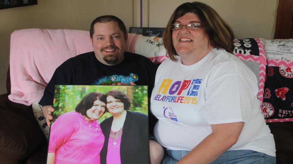 
Chris and Joy Krouper hold up a picture taken of Joy with her sister, Sarah Limestall. Sarah succumbed to caner on Jan. 4, 2014 at St. Joseph’s Hospital in Highland, surrounded by her family. She was just 31 years old.
