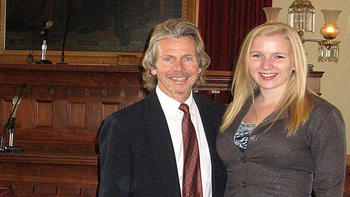 Blackburn College senior and Lincoln Laureate Sarah Collman smiles for a photo with Mark Hopping, cross country coach, at the awards presentation and luncheon held at the Governor’s Mansion on Saturday, Nov. 7.