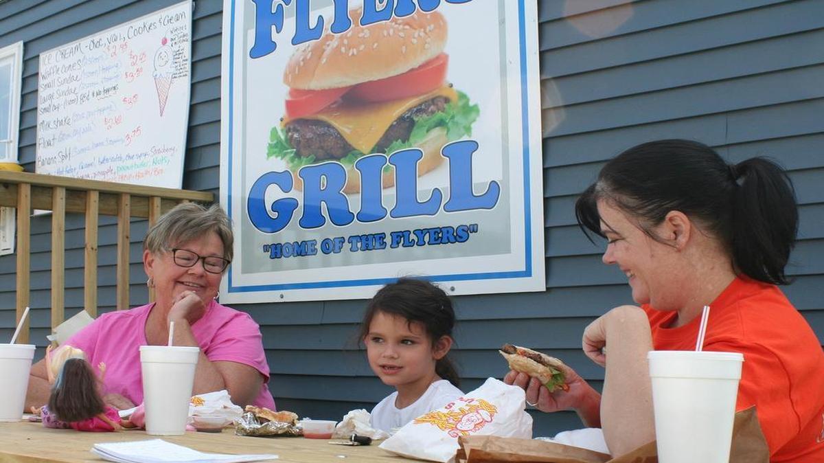 
Jackie Rowely, Hailey Harris and Jamie Manes eat lunch at Flyers Grill in New Douglas.

