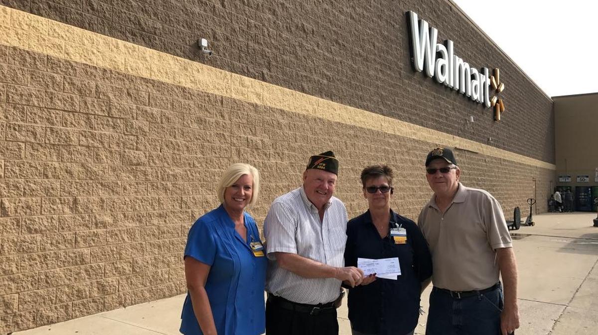 From left are Highland Walmart store manager Janet Kohl, VFW commander Mike Voegele, Walmart assistant manager Paulette Korte, and VFW Post 5694 quartermaster Dave Kampworth.
