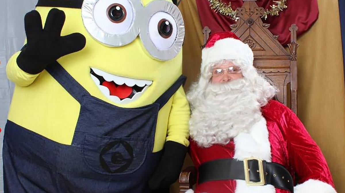 SANTA VISITS ST. JACOB A Minion was Santa’s helper when he visited the village on Dec. 4. They gave out stockings filled with goodies. Photos of the children with Santa were taken by Photo Beast. Hot dogs, chips, Christmas cupcakes and hot chocolate were provided by the Village. The St. Jacob Lions Club prepared popcorn for everyone. Children and the adults enjoyed the Christmas in the Village, which was an open house for the St. Jacob community.