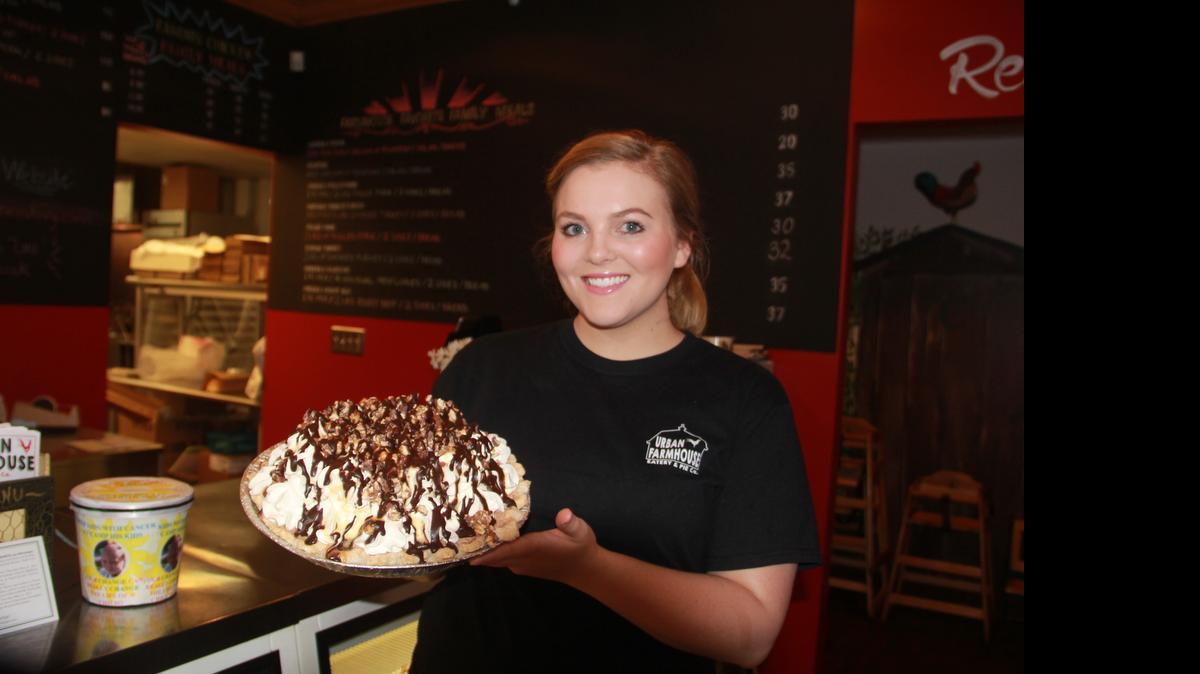 
Allysa Edwards, Urban Farmhouse Eatery & Pie Co. bakery chef, holds up a snicker pie. In early April, Farmers Restaurant and Bakery was named Urban Farmhouse Eatery & Pie Co. 
