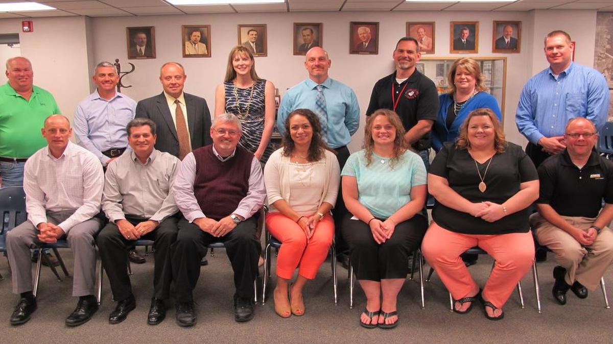 Front row from left are Highland Assistant Superintendent of Schools Derek Hacke, BEA Chairman Kevin Hemann, HHS computer science instructor Max Uhls, HHS computer science instructor Melissa Perks, HMS teacher and BEA Impact Award Recipient Dawn Hubbard, HMS Teacher and BEA Impact Award Recipient Lisa Weder, and vice president of the Highland Education Foundation Todd Korte; back row, HHS agriculture teacher Larry Jones, president of the Highland Education Foundation Jon Basden, Highland Superintendent of Schools Michael Sutton, city of Highland assistant city manager Lisa Peck, HMS Principal Erick Baer, Highland schools Chief Educational Technology Officer Matt Fredericksen, Basler Electric human resources director Lisa Gerner, and commercial loan officer at National Bank of Highland John Keeven.