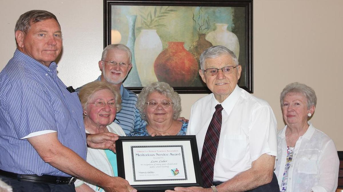 Don Ostrom, president of Clinton County Retired Teachers Association, presents Leon Luber with the Lifetime Educators Award. Pictured from left are Ostrom, Mary Ann Kauling, membership chair; Kelly Kesterson, vice president; Marie Bair, secretary; Luber; and Jan Kauling, treasurer.