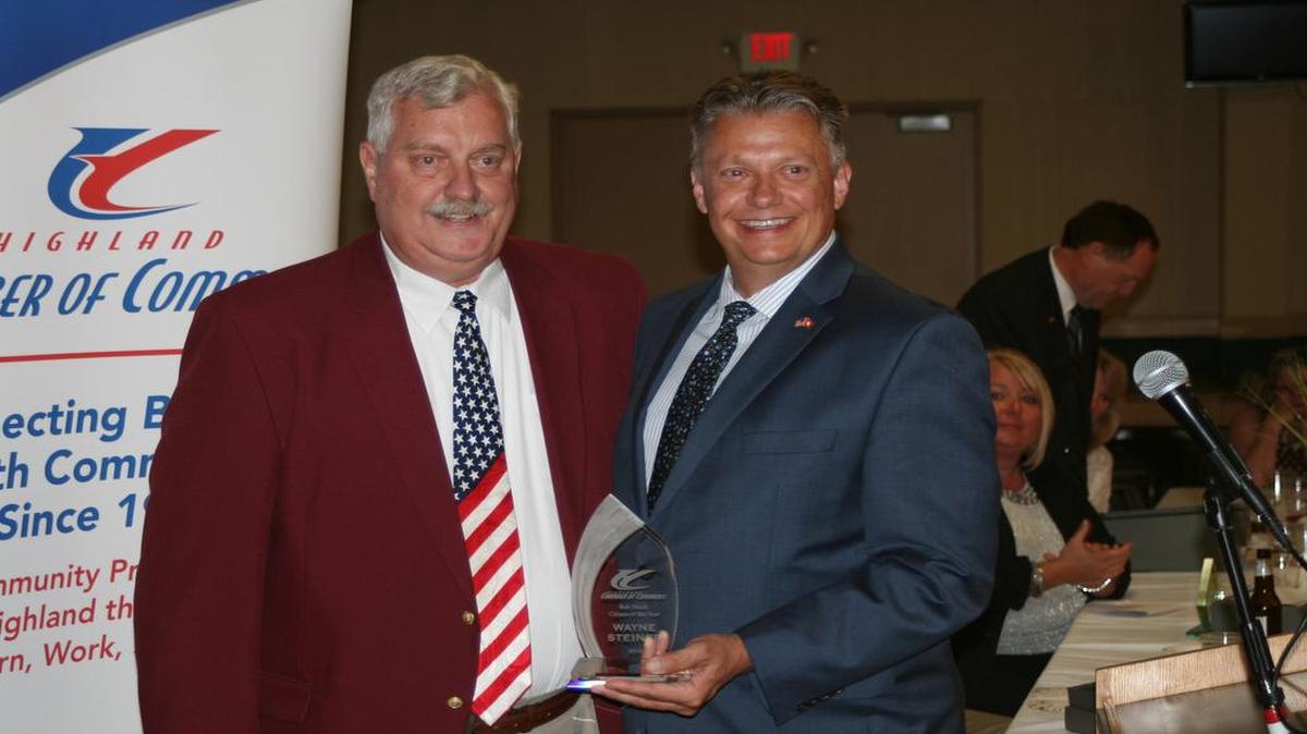 Wayne Steiner (left) accepts the Bob Hardy Citizen of the Year award from Rob Bowman (right).