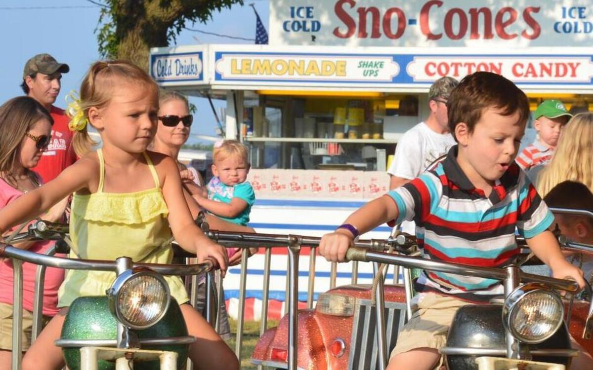 
Addison Bauer, age 4, and Ezra Middendorp, age 5, both of Greenville, enjoy a motorcycle ride at the fair last year.

