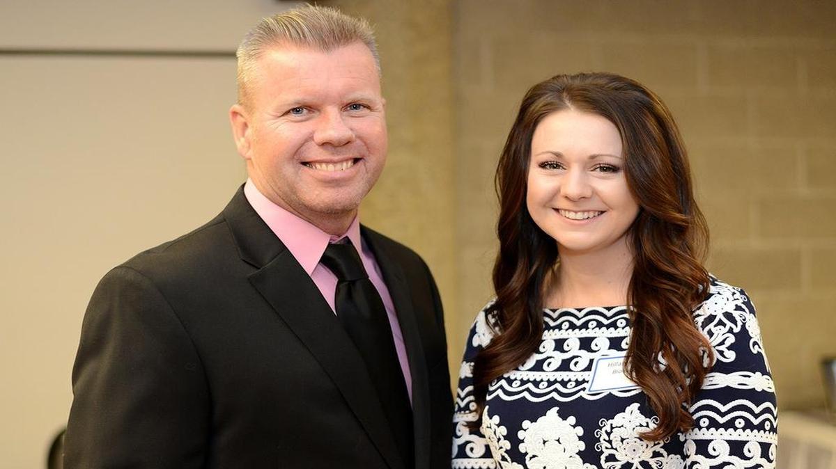Assistant professor of chemistry Stephen Johnson and Outstanding Master’s Thesis Award winner Hillary Rikli of Highland pose for a picture at a reception at the University of Illinois Springfield on Feb. 8.