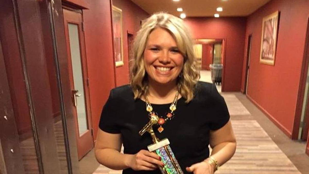 Western Illinois University junior Emily Manley, a 2013 graduate of Highland High School, shows off her trophy after winning the award for Best Community News Award this past Saturday at the 76 th annual Intercollegiate Broadcasting System Conference in New York City.