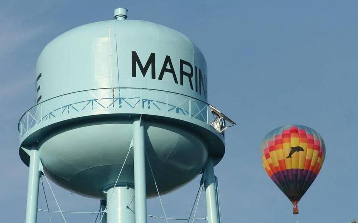 A balloon floats by the Marine water tower during last year’s Hot Air Balloons Over Marine event.