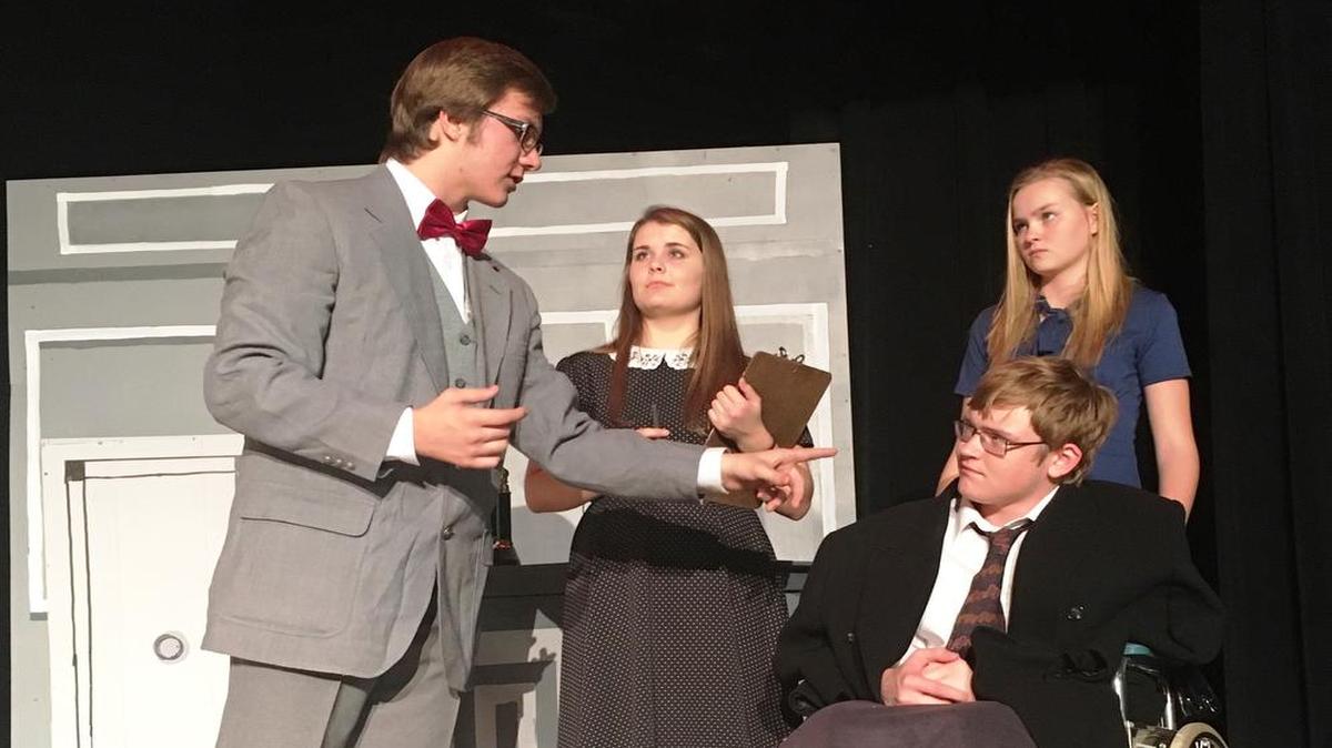 Cast members (left to right) John Hund (George Bailey), Abby Brandenburger (Mr. Potter’s secretary), Joseph Petermeyer (Mr. Potter) and Emma Timmermann (Mr. Potter’s Assistant) rehearse for their performances of “It’s a Wonderful Life” on Nov. 4, 5 and 6.