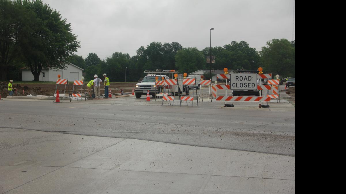 
Keller Construction works on the Troxler Avenue intersection Tuesday morning. The city plans to open Veterans Honor Parkway on Aug. 7.
