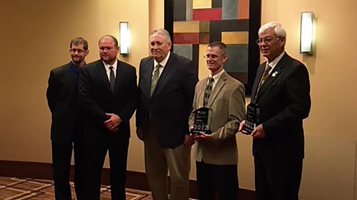 From left are Korte & Luitjohan project engineer Kyle Luitjohan, project superintendent Justin Benhoff, project manager Del Scott and vice president Gregg Korte, and Washington County Board member Gary Suedmeyer.