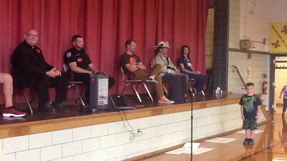 From left, Highland Middle School teacher and coach John Coziar, Father Pat Jakel from St. Paul Church in Highland, Jeremiah Kingery of the Highland Police Department, Pastor Will VerDuin of Evangelical United Church of Christ, firefighter Nic Clasquin from St. Jacob, and nurse Emily Korte from St. Joseph’s Hospital in Highland all spoke to Highland Primary students during the school’s PeaceBuilder program assembly on Sept. 15.