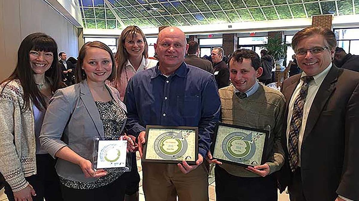 From left, Kim Petzing from Madison County, Emily Fultz from Madison County, Lisa Peck from the city of Highland, Mark Rosen from city of Highland, Matt Asselmeier from the city of Alton, Alton Mayor Brant Walker, show off their awards citing their ‘green’ efforts.
