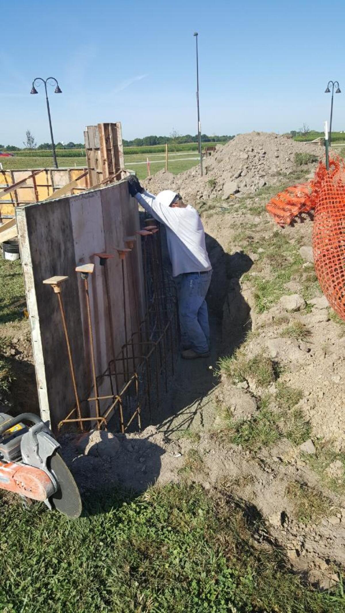 Construction of the Wall of Remembrance and Honor at Dennis H. Rinderer Park in Highland.