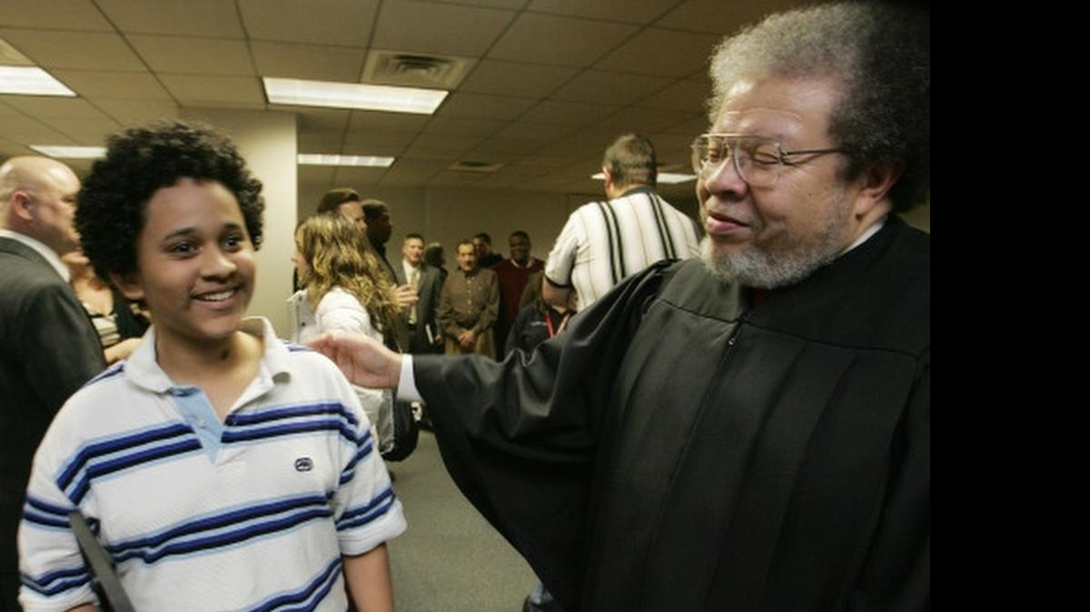 
In this file photo, Madison County Associate Judge Duane Bailey congratulates a graduate of a juvenile diversion program at the Madison County Courthouse. Bailey is one of five associate judges who has not been retained.
