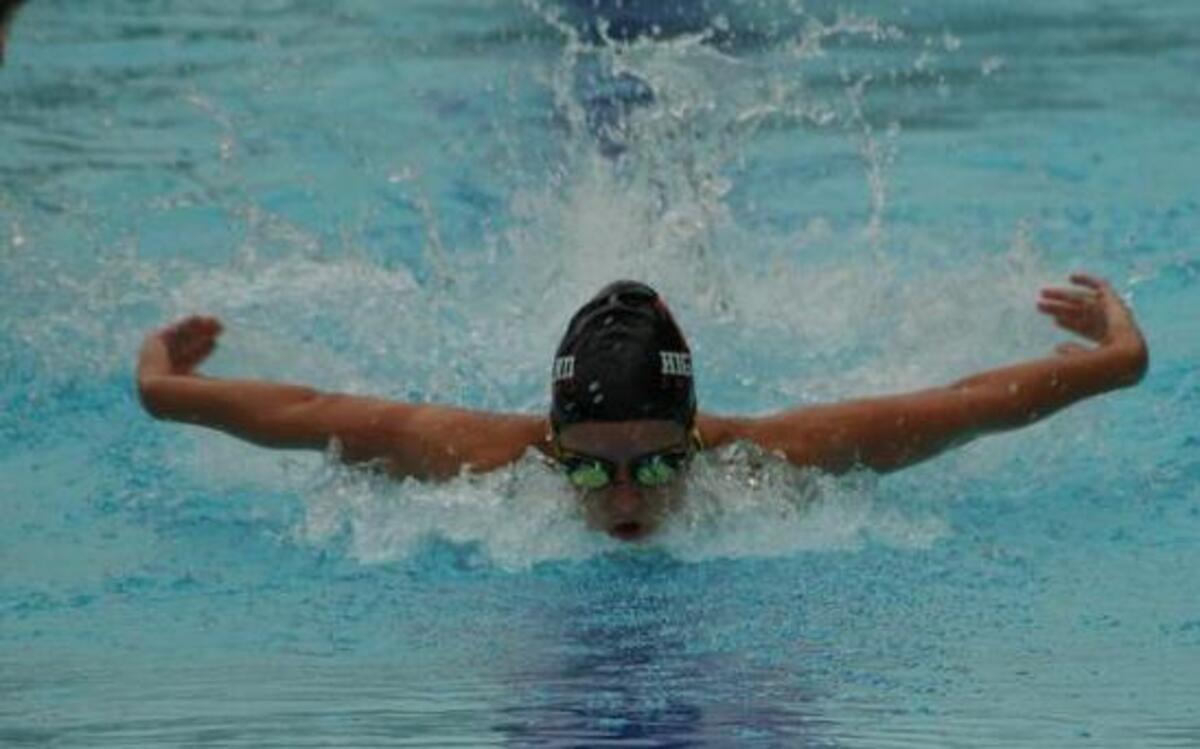 
Highland Splash swimmer Alyssa Freimann, a 15-year-old shown swimming butterfly last Thursday night, captured gold all three of her individual events (in the following order): the 100-meter breaststroke, the 100-meter individual medley and the 50-meter butterfly.
