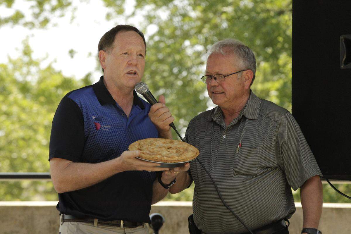Howard Held of Scheffel-Boyle, left, will again participate in the Highland Relay for Life Celebrity Pie Auction fundraiser hosted by the Oldies but Goodies team. After not having the auction in 2020 due to the COVID-19 pandemic, the 12th annual event will take place Friday, July 23. Pictured with Held at the 2018 event is Auctioneer Virgil Straeter, who will serve in the same role this year.