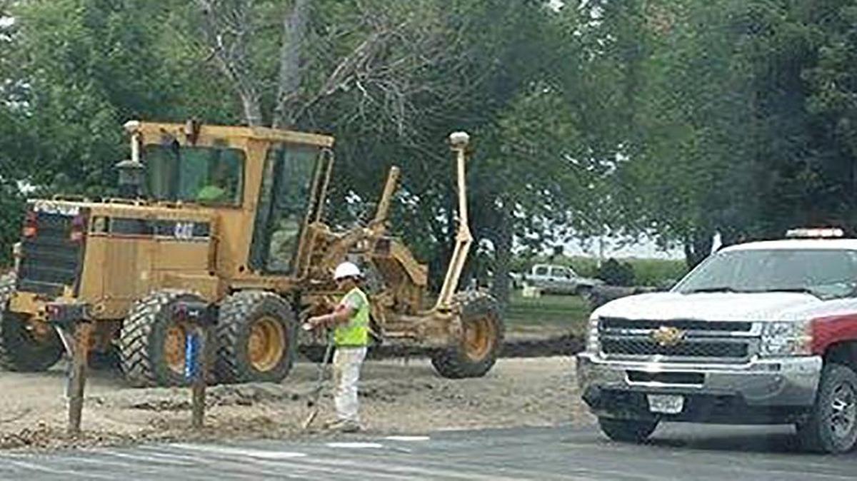 
Workers with Keller Construction put final touches on Veterans Honor Parkway on Tuesday.

