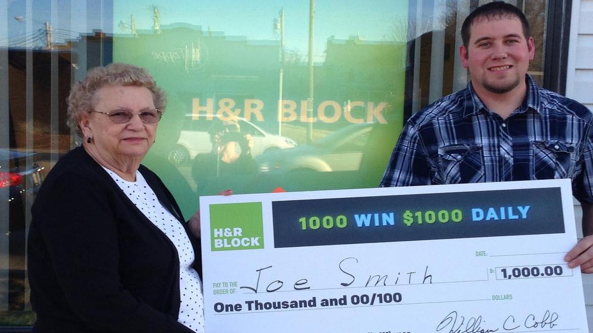 Joe Smith was recently presented his check by Betty Voss of Highland H&R Block office.