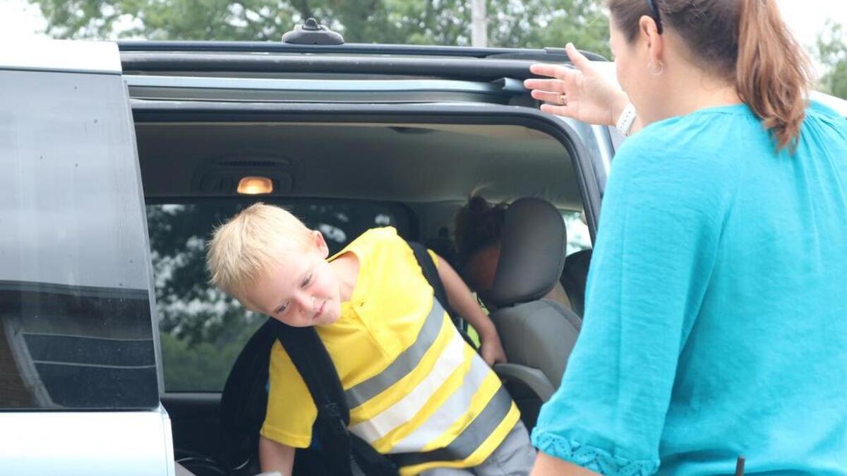 Dayton Heilig, 6, hops out of the car and off to his first day of first grade at Alhambra Primary School last fall.