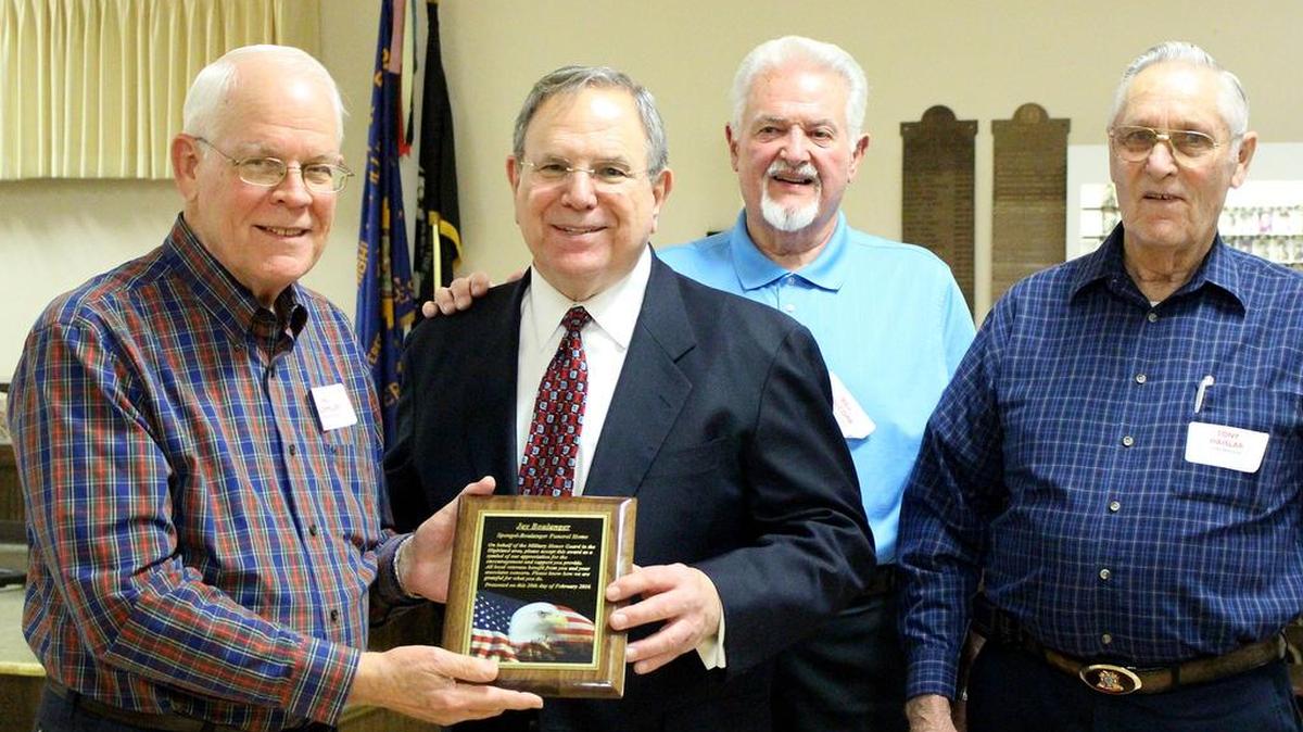 The Honor Guard presented Jay Boulanger with a plaque to recognize both him and the Spengel-Boulanger staff for their efforts in making it possible to render their services to deceased military members and their families. From left are Val Buchmiller, Jay Boulanger, Bill Holcomb and Tony Haisler.