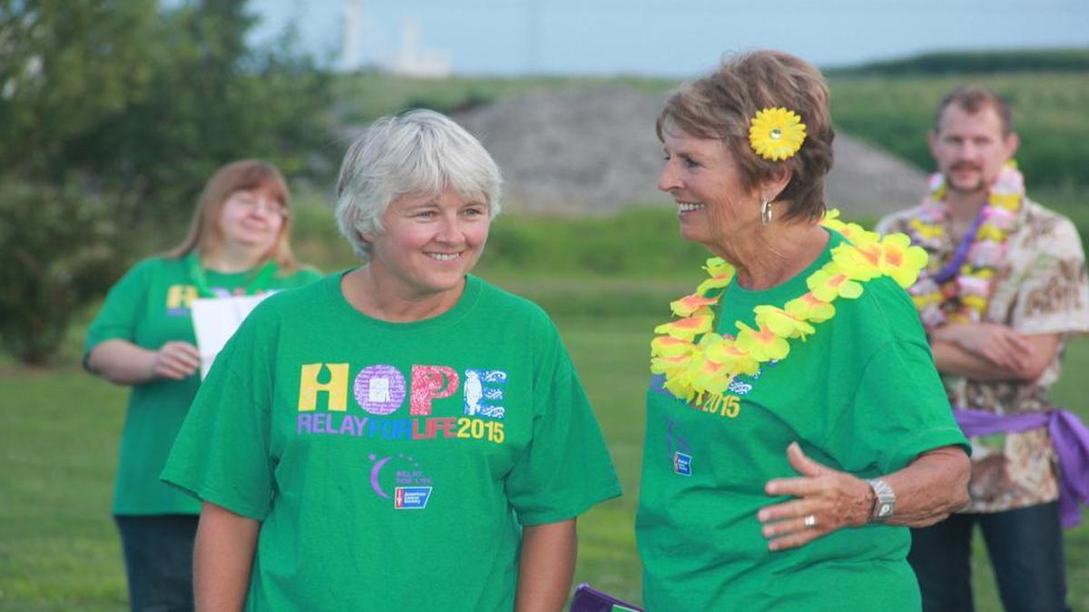 Kathy Walker and Paula Redman share a laugh at last year’s Relay For Life in Highland.