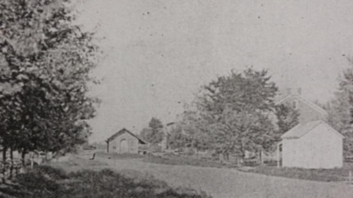 From Pine Street, looking west, the old Market House in Highland was in the middle of Broadway.