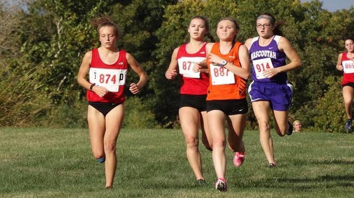 
From left, senior Allison Zobrist, junior Sarah Beth Wiegman and freshman Kate Marti run together en route to finishing in fourth, fifth and eighth to lead the Lady Bulldogs to the team title at the Mississippi Valley Conference Championships last Thursday at Principia College in Elsah.
