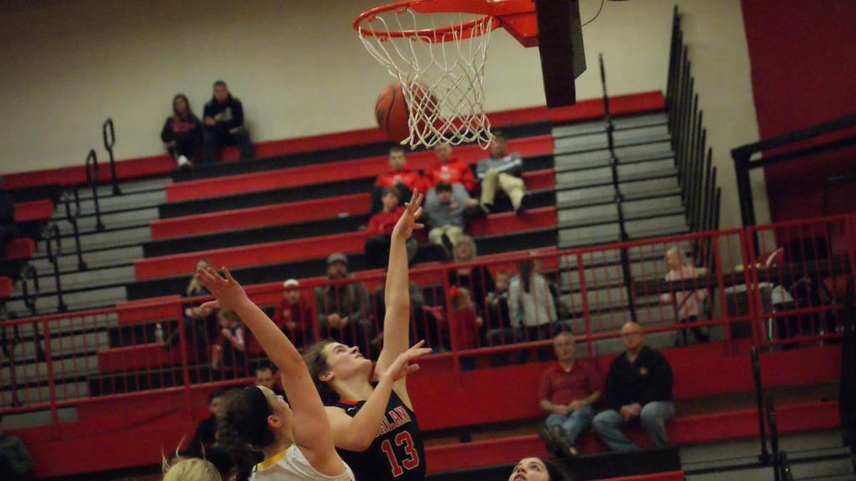 Highland freshman Bella LaPorta looks to score inside over Civic Memorial sophomore Anna Hall during the second half of the Lady Bulldogs’ 51-45 loss to the Eagles in the Saturday afternoon in the third-place game of the 32nd Annual Highland Scott Credit Union Girls Basketball Touranment.